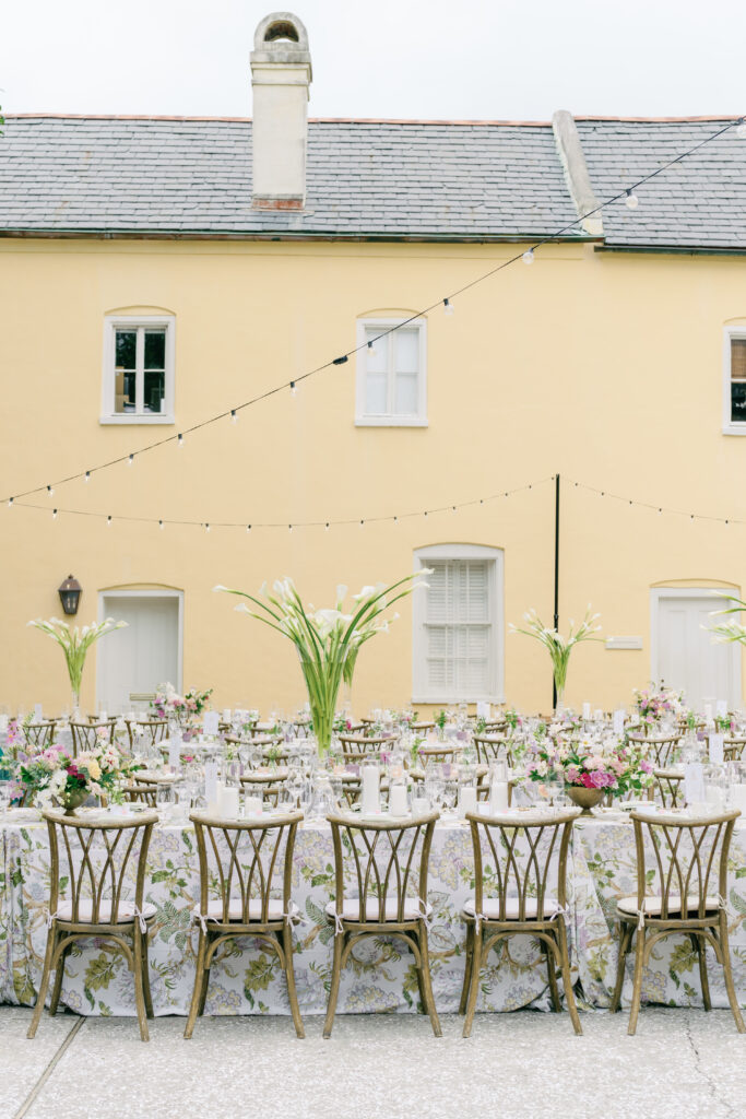 String lights and yellow walls at william aiken house wedding reception. 