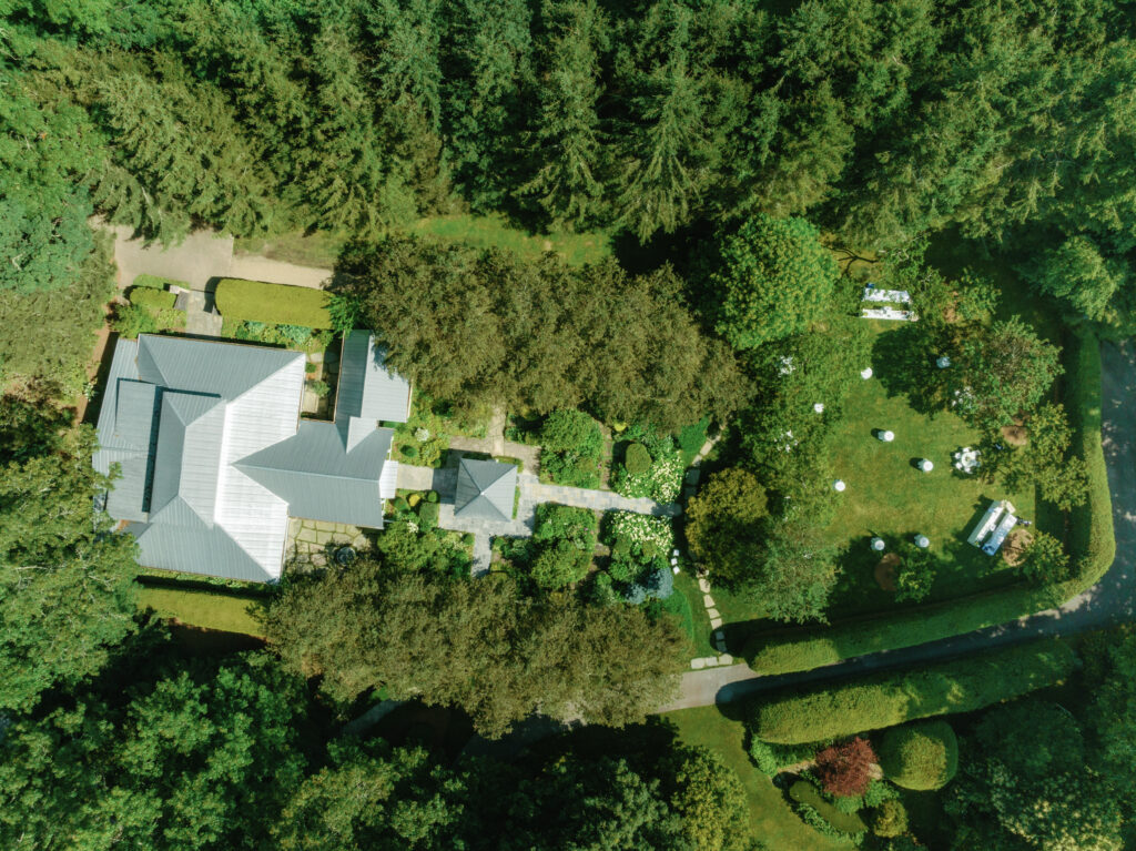 Drone photo of the orchard house. Cocktail hour in the apple orchard. 