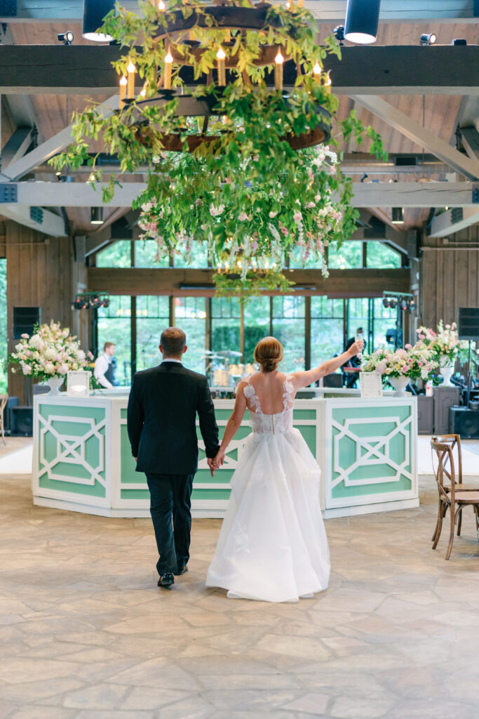 Bride and groom see their wedding reception space for the first time. The pavilion at the farm at old edwards. 