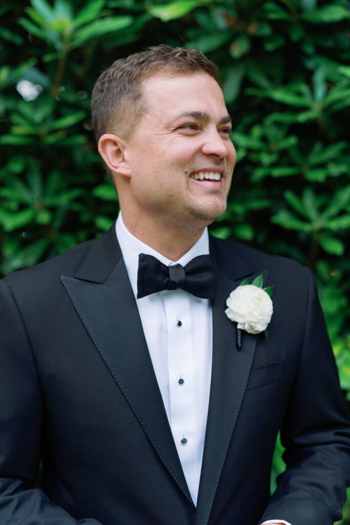 Highlands NC groom in black tuxedo with white boutonniere 