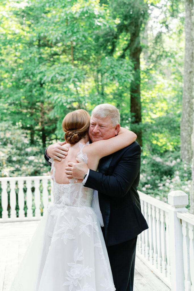 Father of the bride sees daughter for the first time on wedding day. 