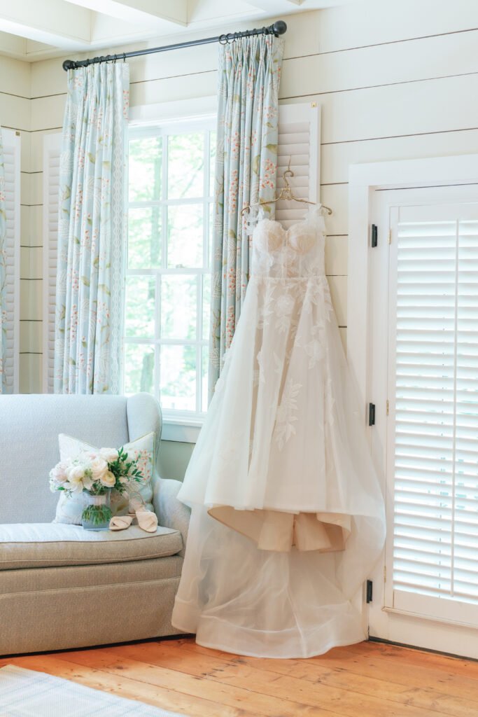 wedding dress hanging in the cottage at the farm at old edwards. 