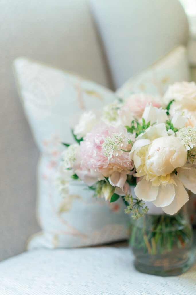 White wedding bridal bouquet with touches of pale pink and pale yellow.