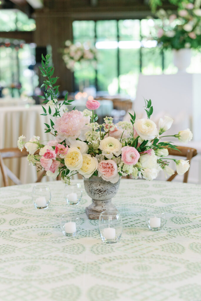 flowers on a green and white linen tablecloth