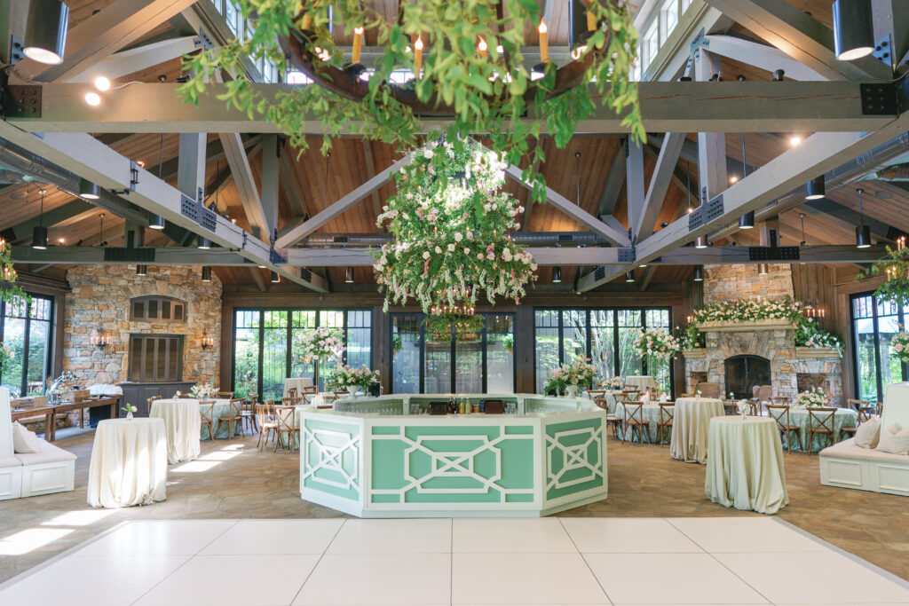 Green and white wedding reception in the pavilion at the farm at old edwards. 