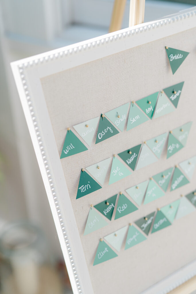 Different shades of green triangles wedding seating chart. 