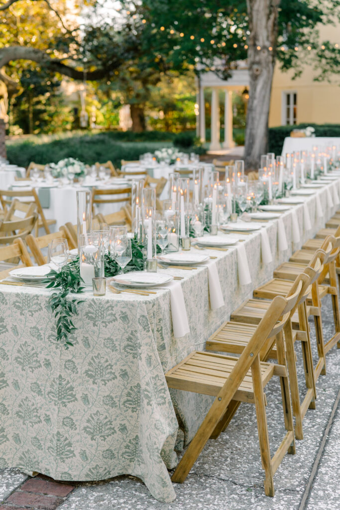 White and green wedding reception design. Leaf and grape table linens. 