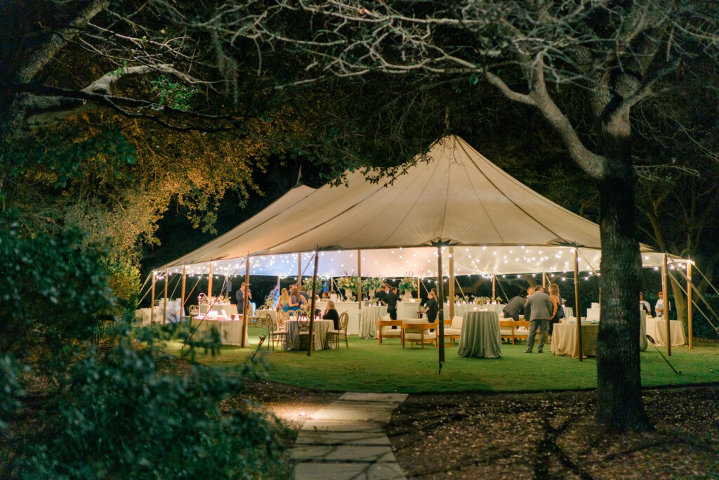 Wedding welcome party under sailcloth tent on Kiawah Island