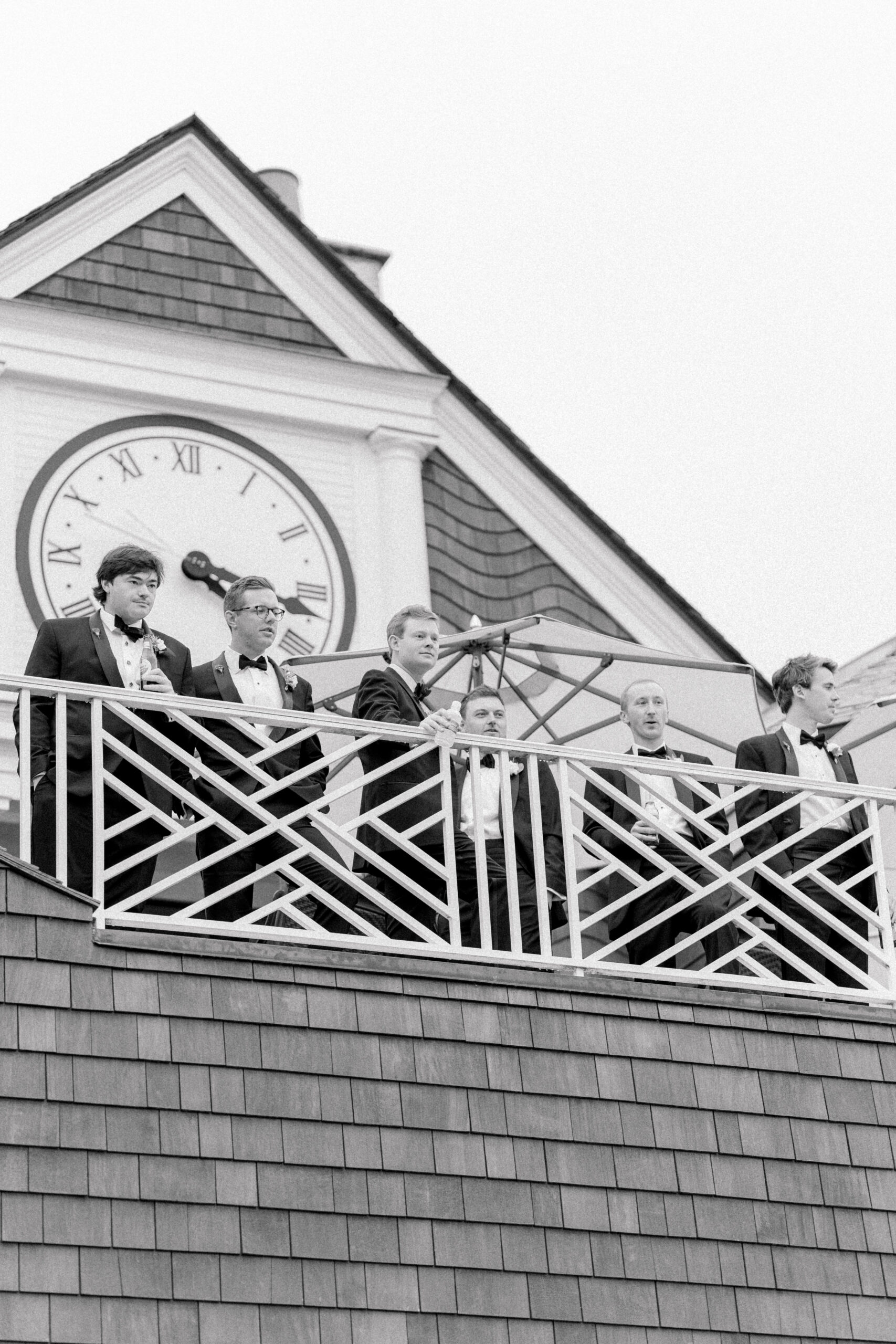 Groom and groomsmen on the balcony of the mens locker room at Kiawah River Course wedding. 