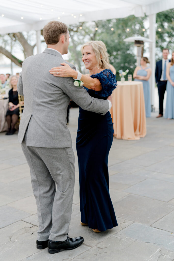 Groom dances with his mom. 
