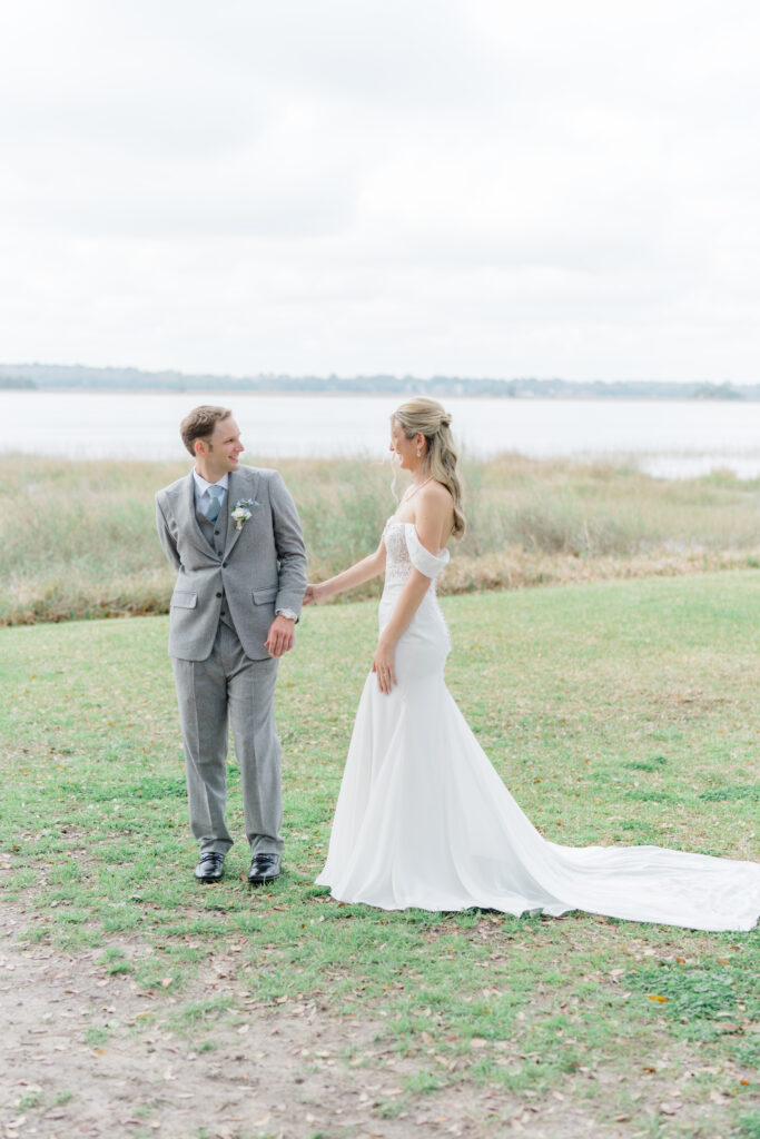 Waterfront first look at Lowndes Grove winter wedding.