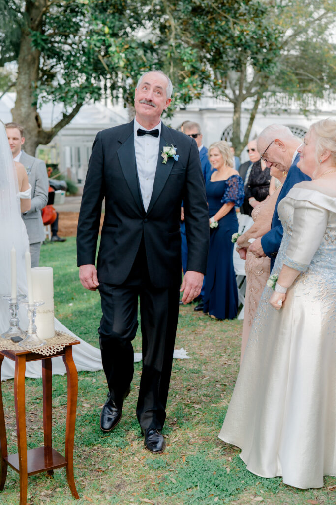 Father of the bride fights back tears. 