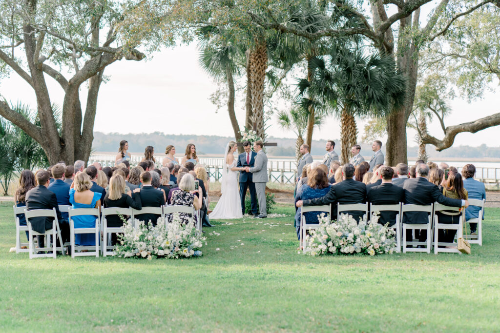 Charleston wedding ceremony with palm trees. 