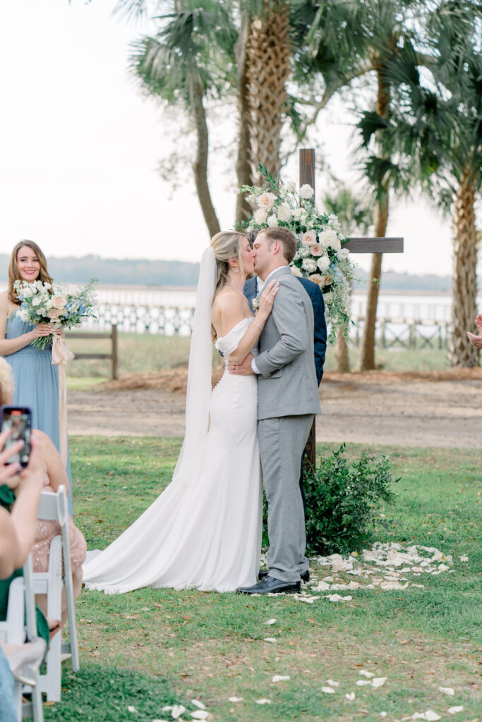 First kiss at Lowndes Grove wedding ceremony.