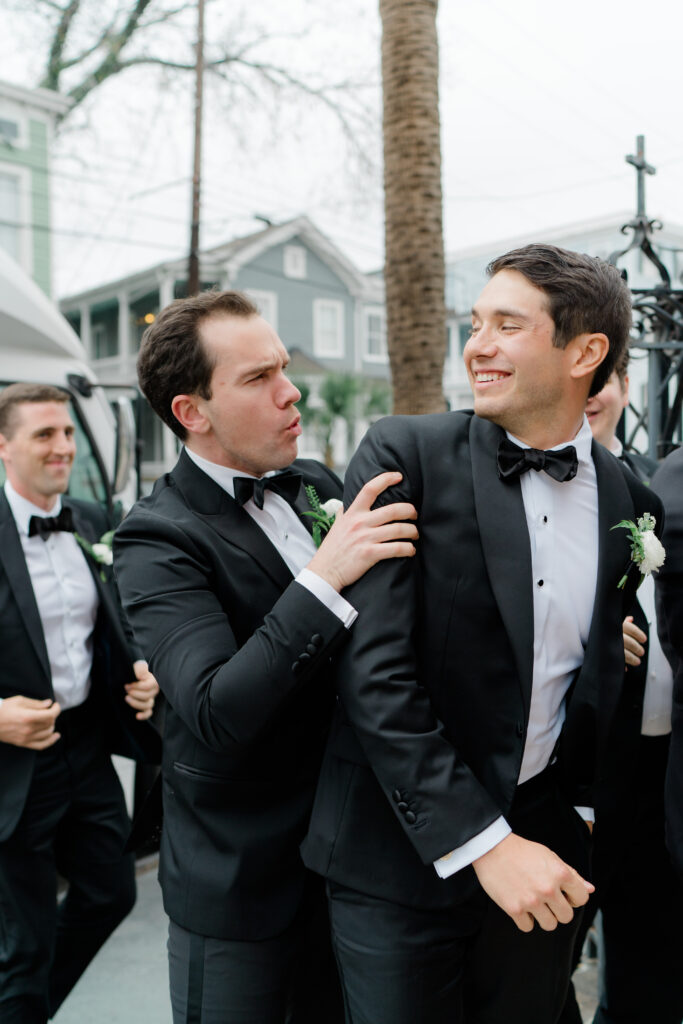 Groomsmen grabs groom before wedding ceremony in Charleston. 