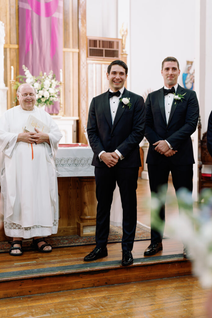 Groom sees the bride at the altar at Charleston spring church wedding ceremony 