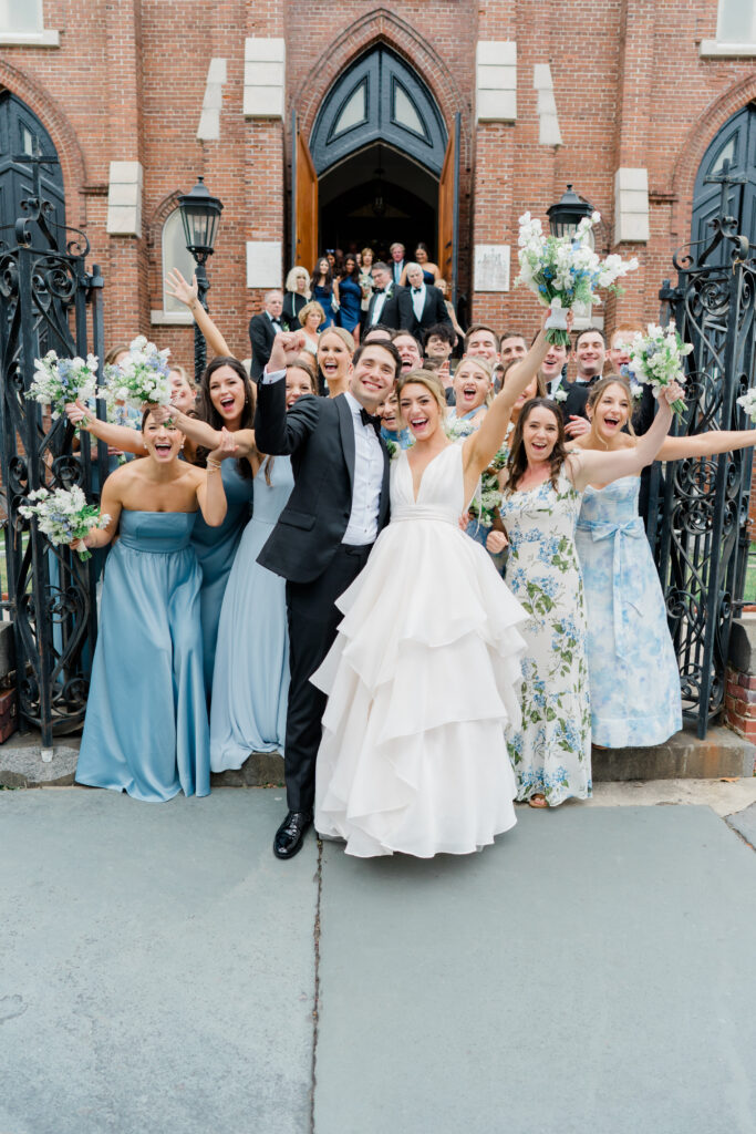 Fun photo of couple with bridal party after wedding ceremony. Charleston spring wedding.