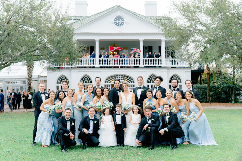 Full bridal party group photo in front of Lowndes Grove. 