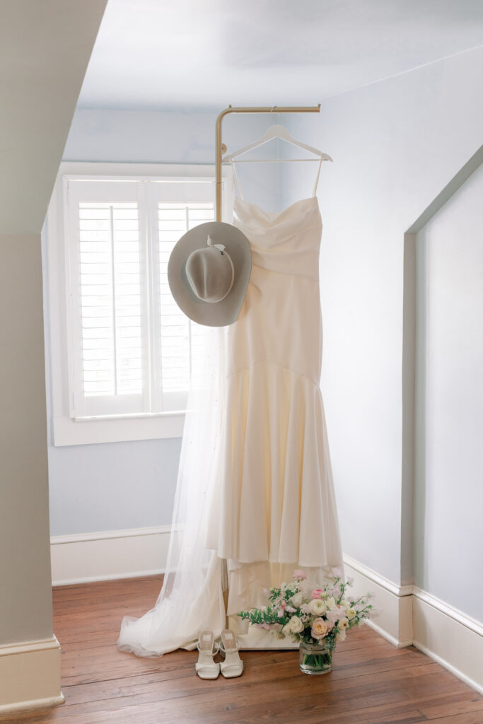 Wedding dress hanging on the morning of wedding day. Charleston wedding photographer. 