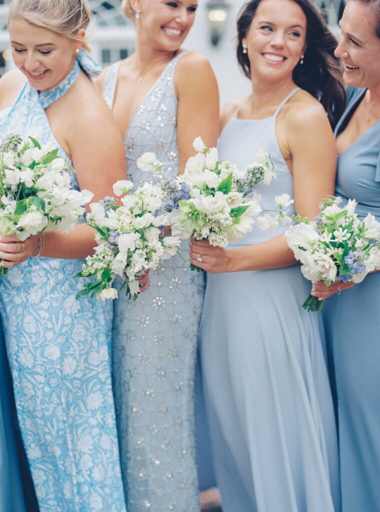 Bridesmaids in mixed matched blue and patterns. Charleston spring wedding.