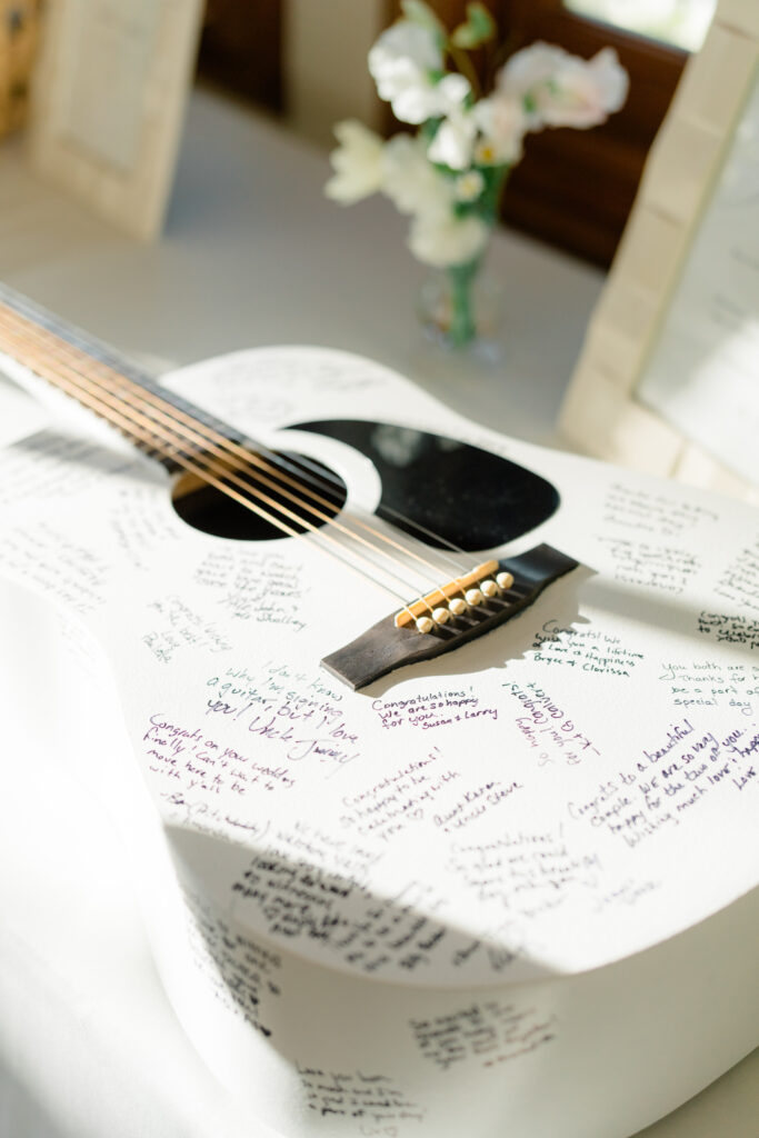 This couple used a white guitar as their guest book.