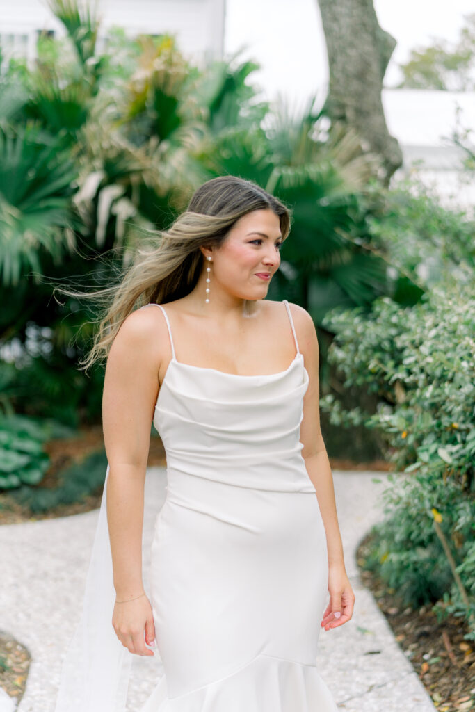 Lowndes Grove bride portrait with green palm leaves in background.