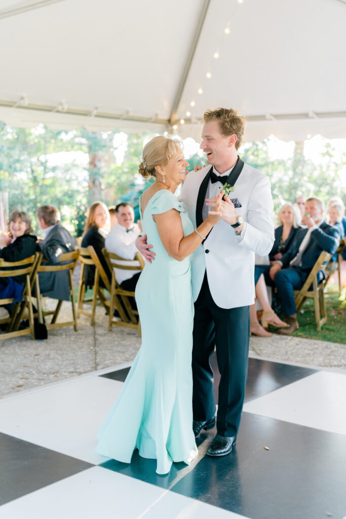 Groom dances with his mom at spring wedding.