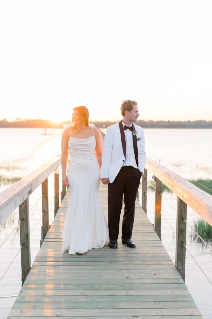 Creative bride and groom portrait at sunset. 