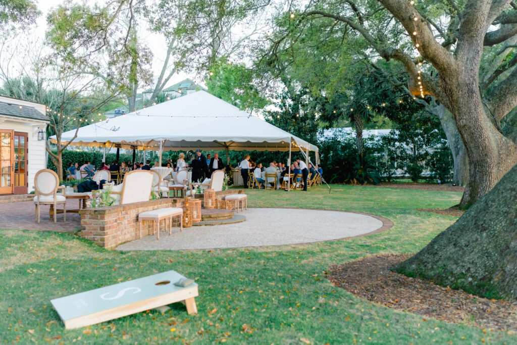 Wedding reception at sunset under the tent. The River House at Lowndes Grove. 