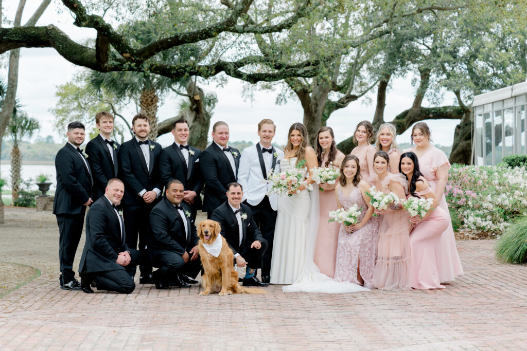 Full bridal party group photo including the couples gorgeous golden retriever. 