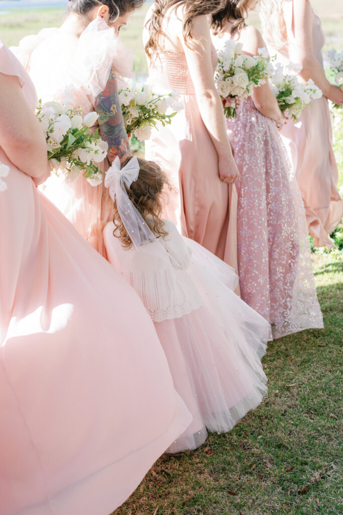 Mix-matched shades of pink bridesmaids dresses. 