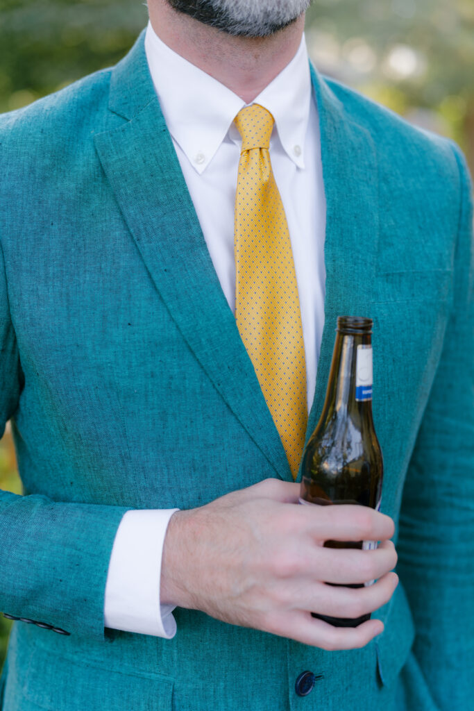 Inspiring men's guest attire at a wedding. Teal suit and gold tie. Spring wedding in Charleston. 