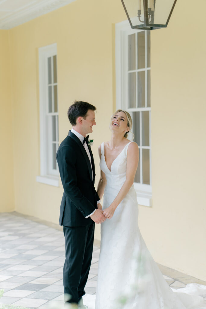 Bride and groom laugh together. Charleston destination wedding photographer. 