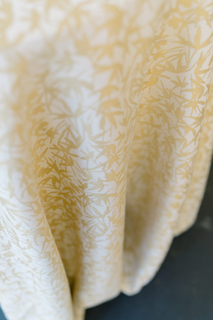 Gold and white leaf pattern linens. Charleston spring wedding. 