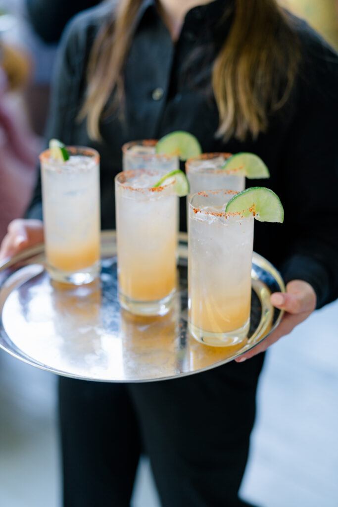 Taijin rimmed cocktails with a lime garnish. 