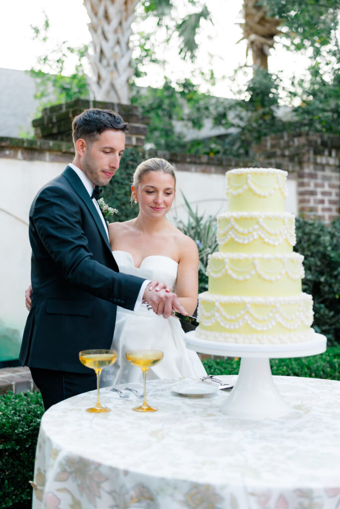 Bride and groom cut the cake. 