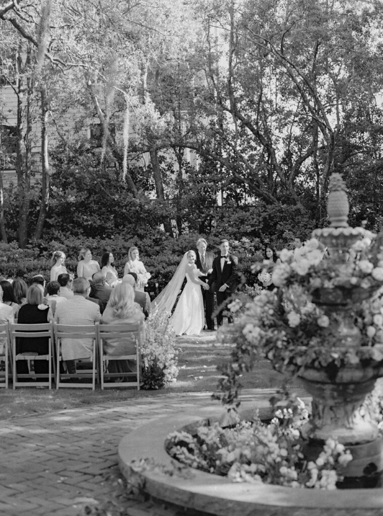 Documentary style black and white wedding photo during Charleston destination wedding.