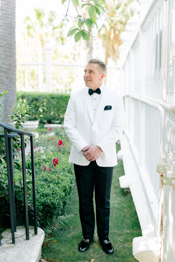 Father of the bride in white tuxedo jacket