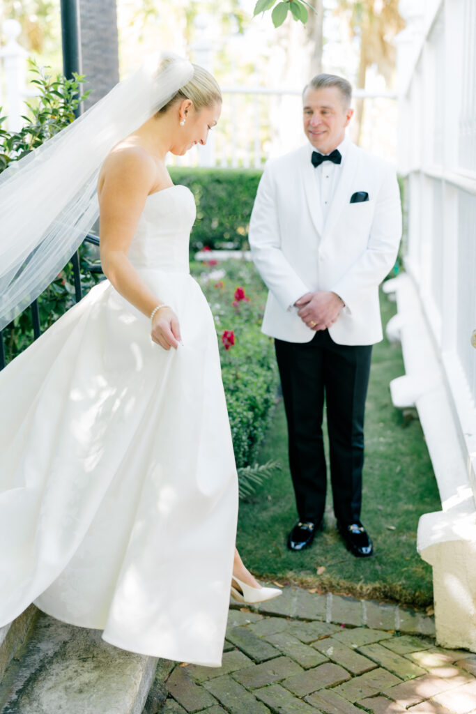 Father of the bride first look. Dad sees his daughter in wedding dress for the first time on her wedding day. 