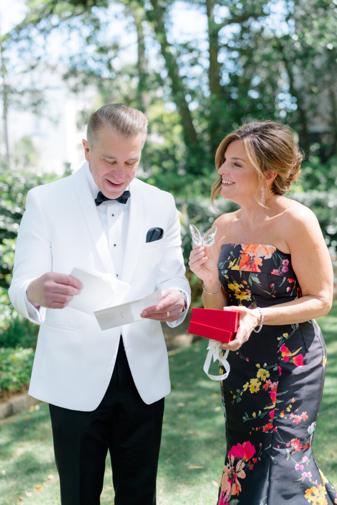 Bride gets her parents a small gift during wedding day. 