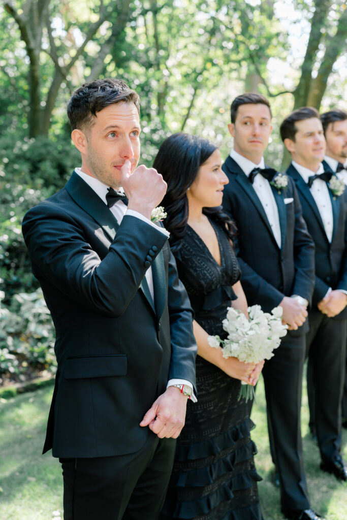 Groom at outdoor wedding ceremony in Charleston. 