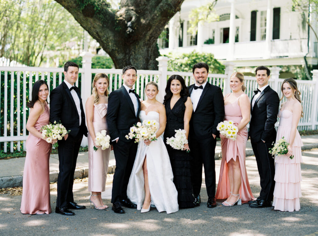 Full bridal party in the street in front of Governor Thomas Bennett House. Pink and yellow wedding. 