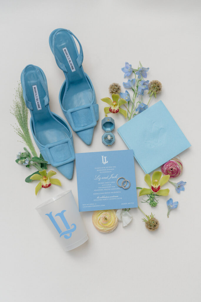 Manolo Blahlnik blue heels and plastic cup with custom logo. Wedding rehearsal dinner coordinating detail ideas. 