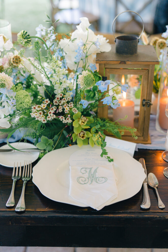 Place setting at outdoor rehearsal dinner. Wedding florist gets married in Beaufort Sc. 