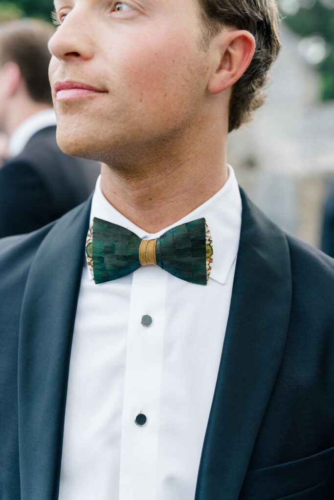 Wedding guest shows off his brackish bow tie. 