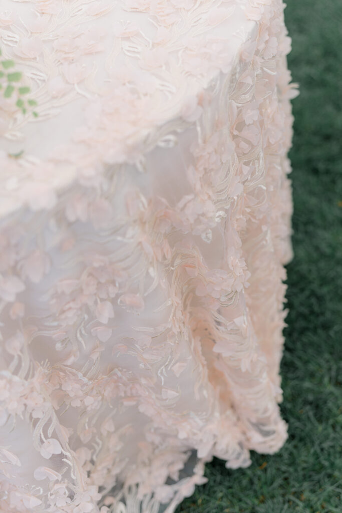 Textured floral table linens with lace pink color. 