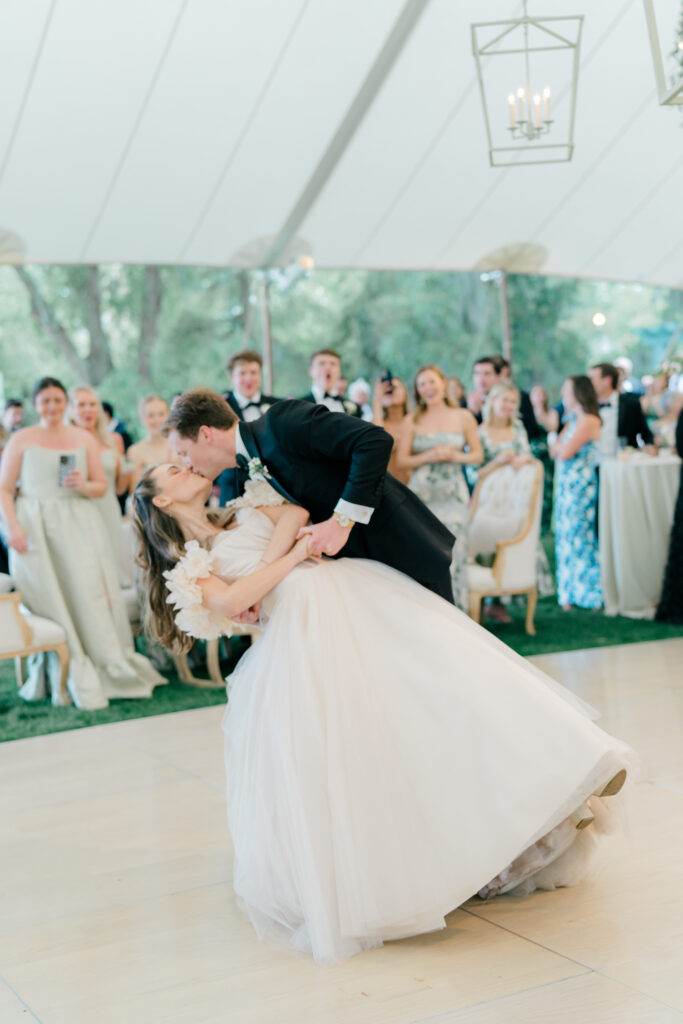 Bride and groom first dance dip kiss. 