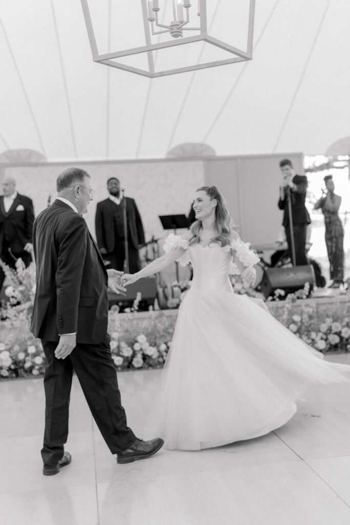 Bride dances with her dad. 