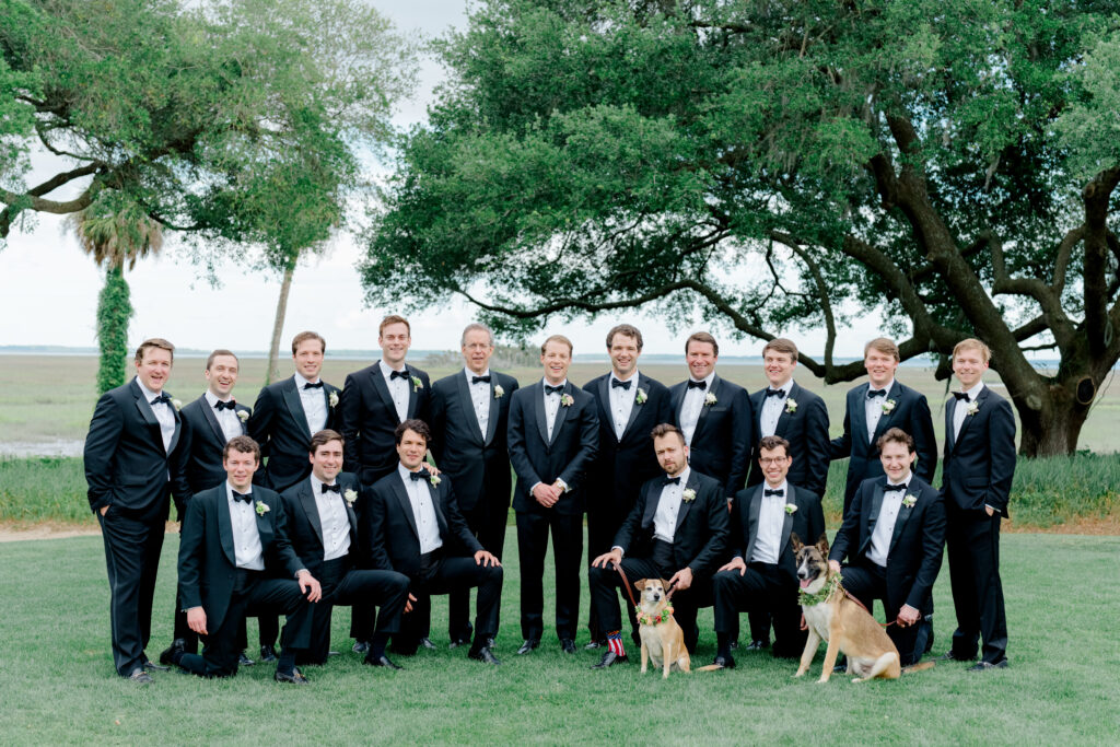 Big grooms party picture with dogs. 