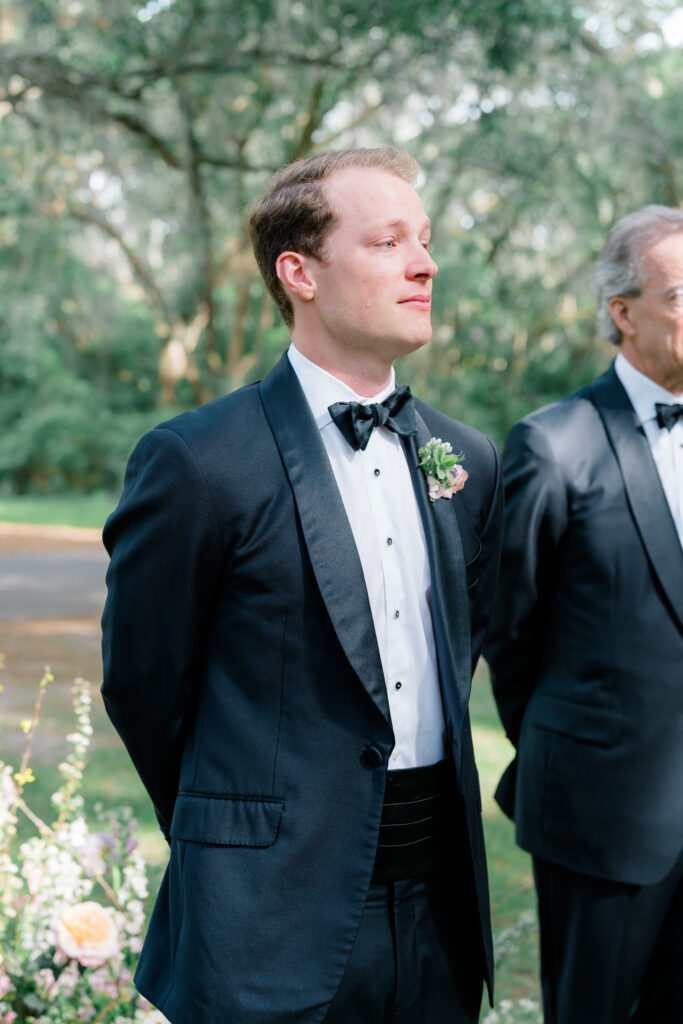 Groom tears up at wedding ceremony. 